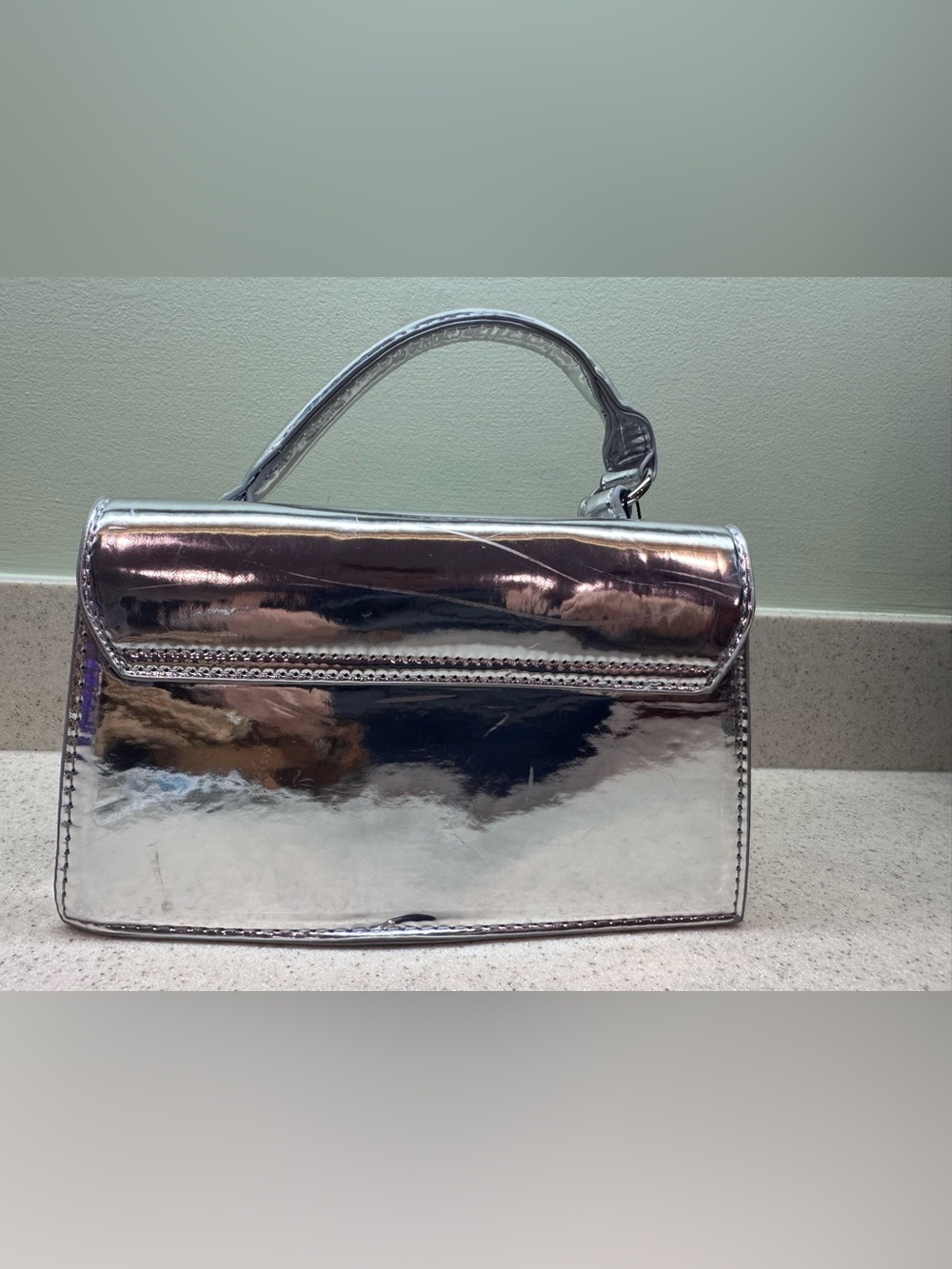 Small silver metallic handbag
